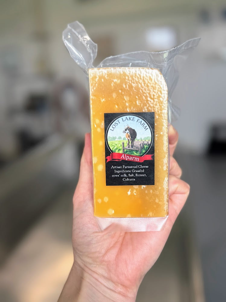 A close-up view of the crystalline, crumbly texture of Alparm, a small-batch hard grating cheese from Lost Lake Farm.