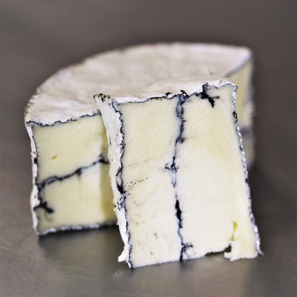 A 1/2-pound wedge of Lost Lake Farm's farmstead cheese, part of the Root to Rise CSA cheese add-on.